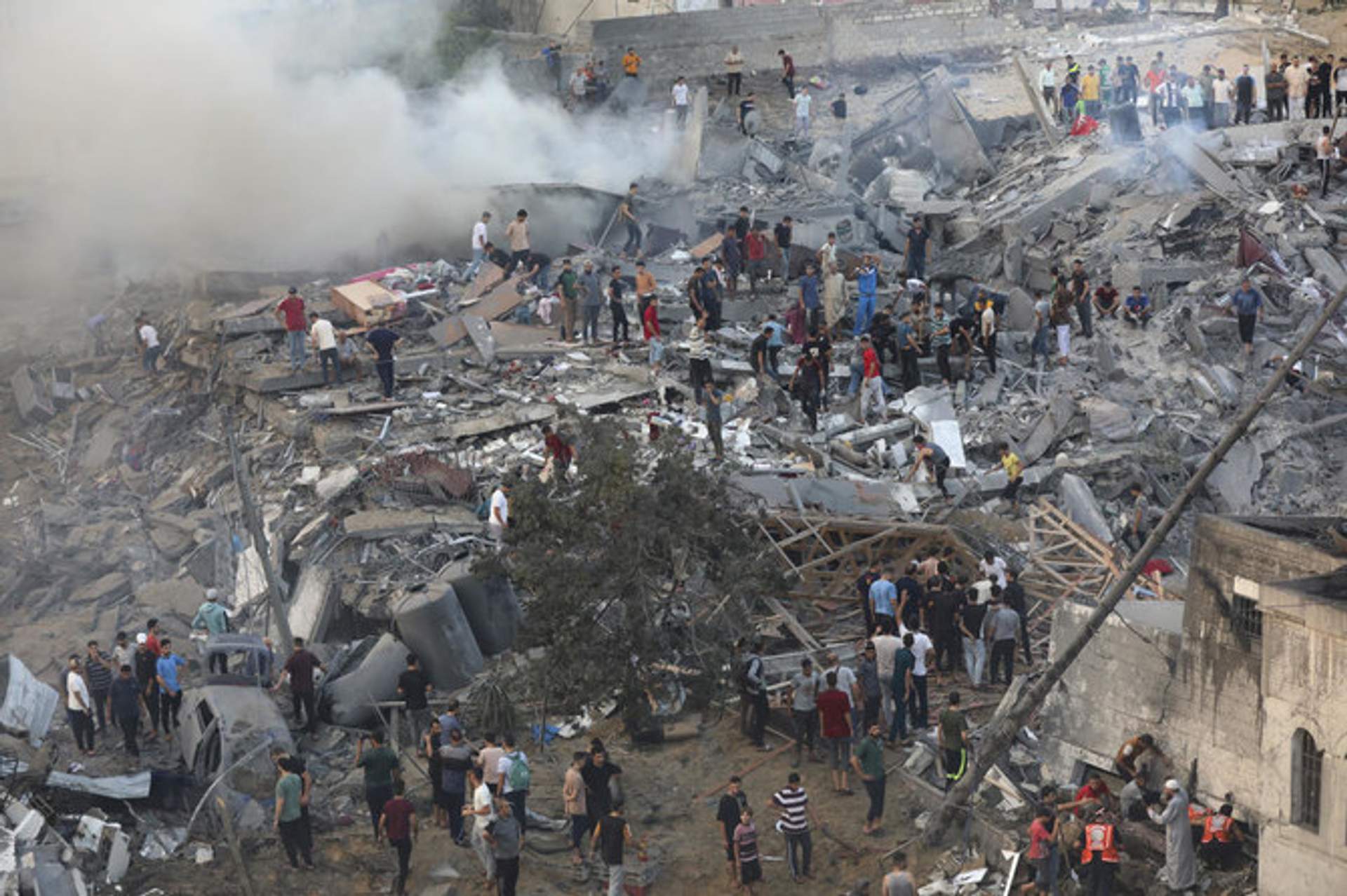 Palestinians inspect the damage of destroyed buildings following Israeli airstrikes on Gaza City, Wednesday, Oct. 25, 2023. (AP)