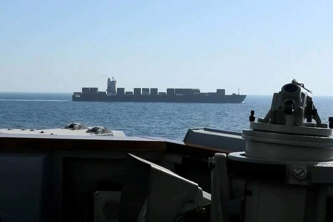 Large Iranian-flagged cargo ship M/V Touska seen from the deck of a U.S. Navy ship