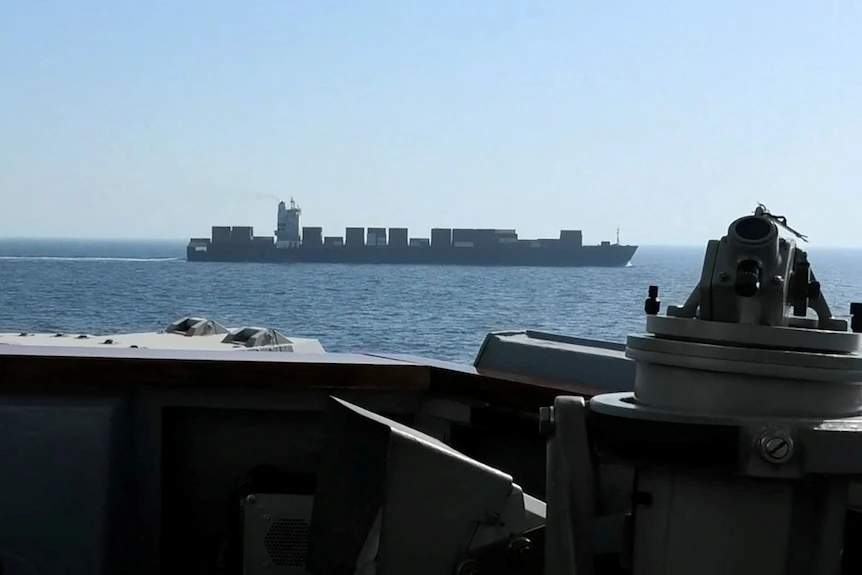 Large Iranian-flagged cargo ship M/V Touska seen from the deck of a U.S. Navy ship