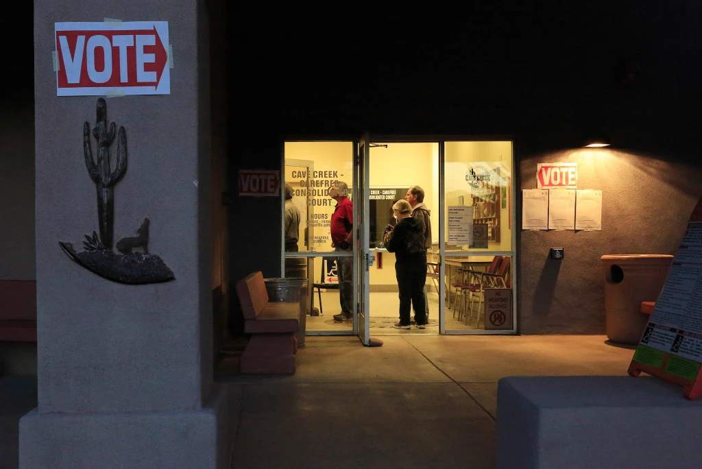 Demonstrators gather at a protest over long voting lines