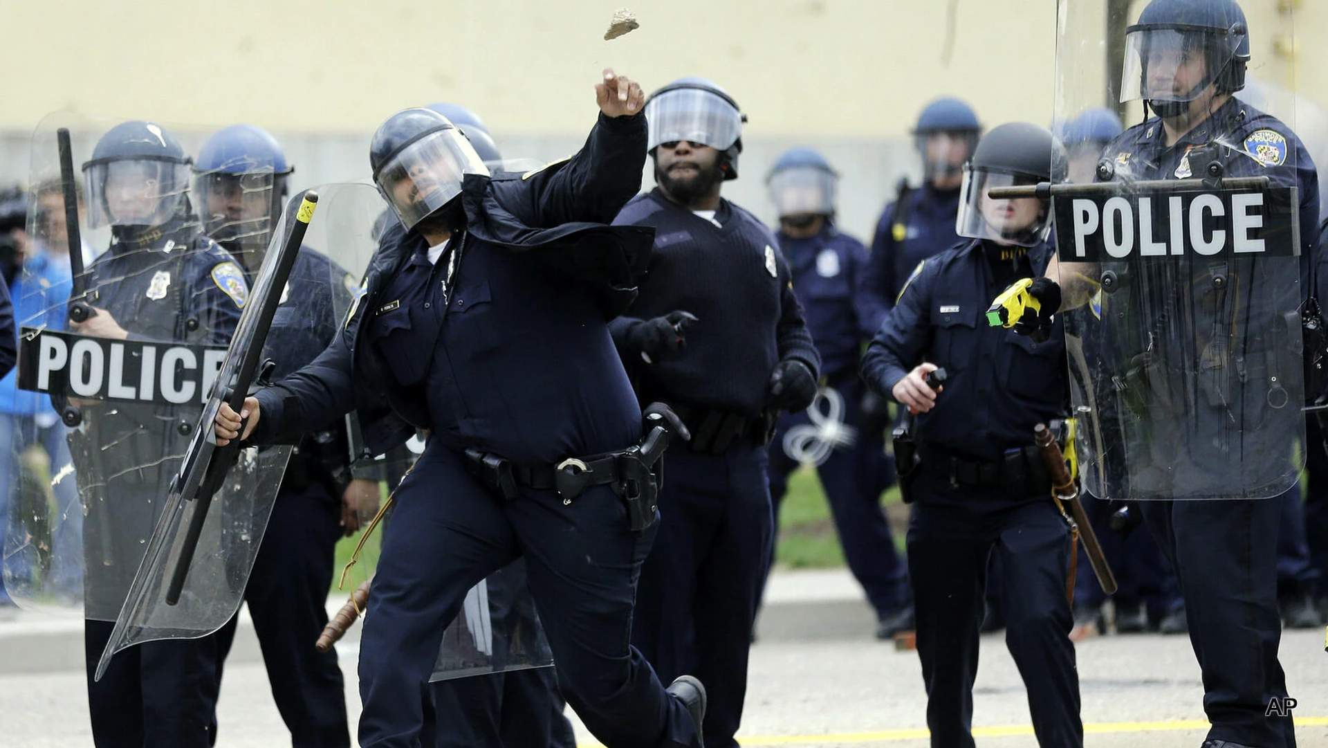 Balitmore police throwing riot munitions at protestors after the death of Freddie Gray.