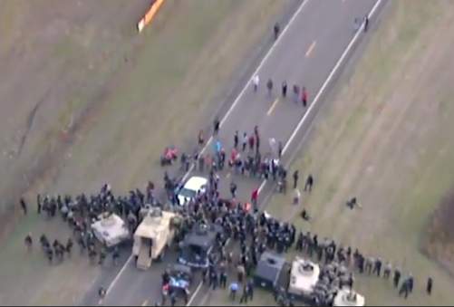 Police drone footage still shot of the moment Red Fawn Fallis was tackled β The Intercept files
