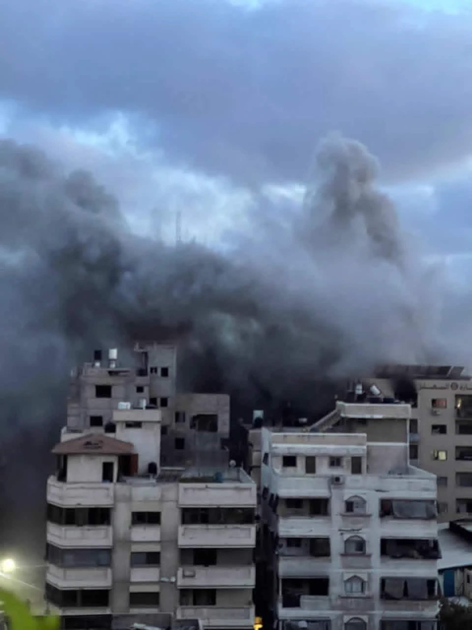 Black smoke rises from Gaza residential neighborhoods following IOF airstrikes, May 15, 2026. [Salah Akram - UnTelevised Media]