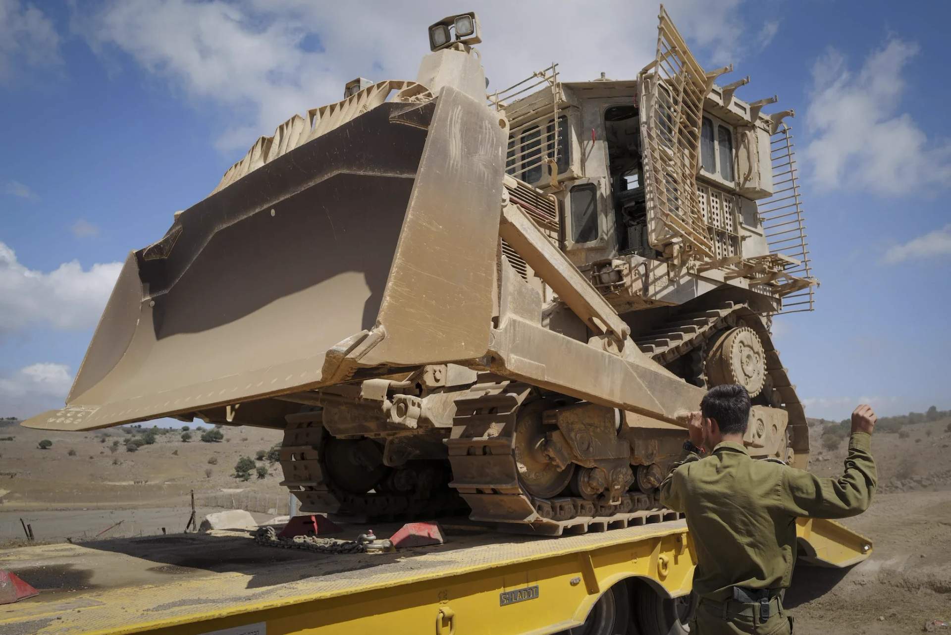 Israeli military bulldozer conducting demolition operations in Gaza
