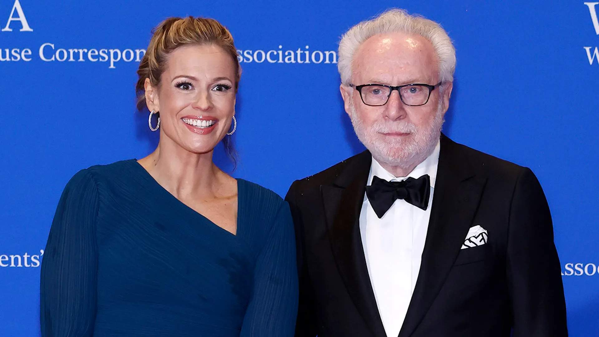 CNN journalists Pamela Brown and Wolf Blitzer in formal attire at the White House Correspondents' Dinner, highlighting the coziness between press and politicians