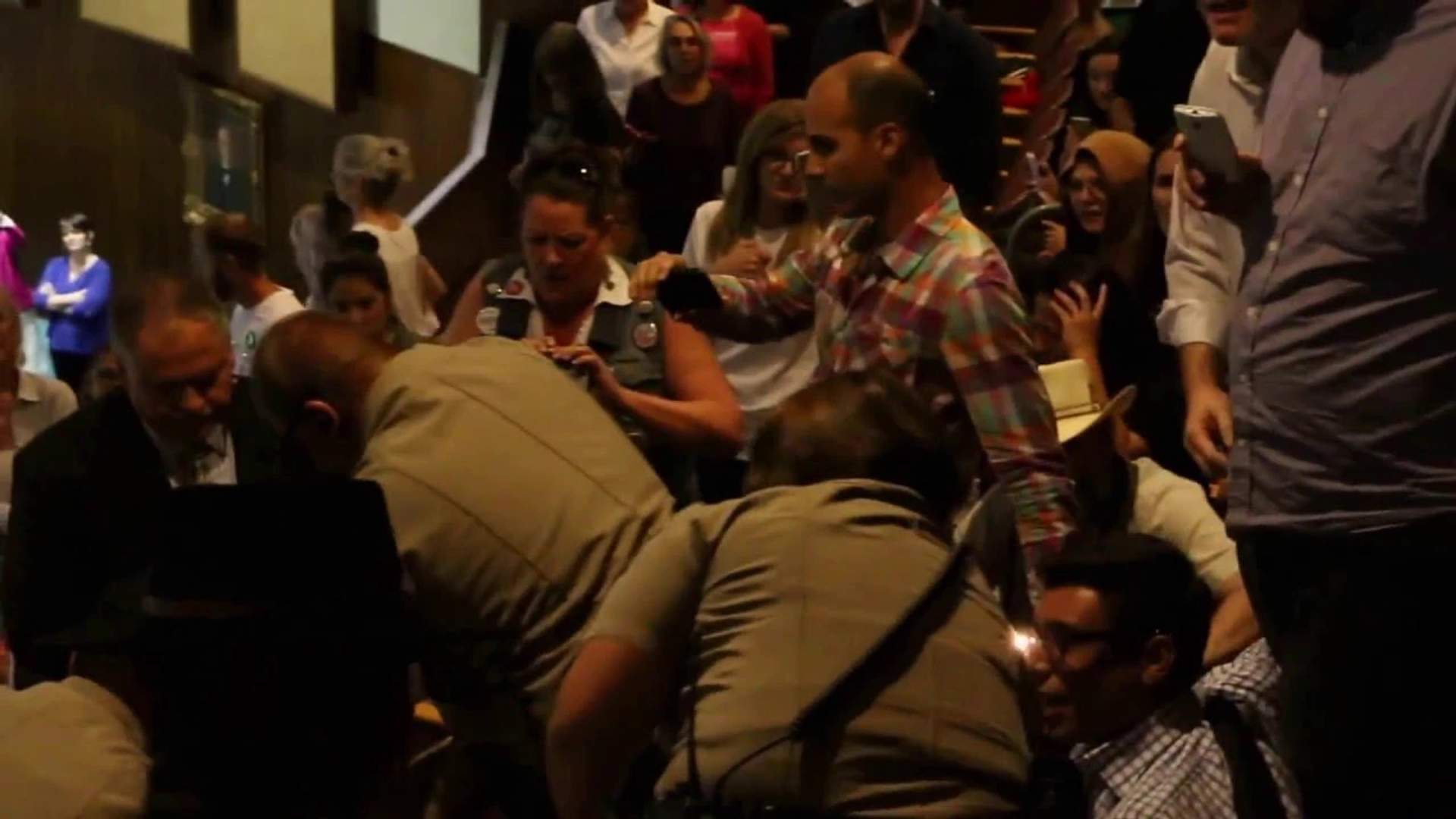 Troopers from the Arizona Department of Public Saftey arrest Jonathan McRae in the gallery of the Arizona House of Representatives after a contentious House Elections Committee hearing March 28.
