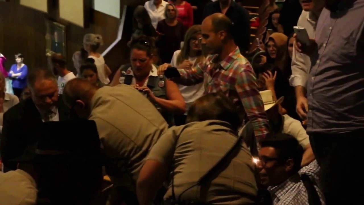 Troopers from the Arizona Department of Public Saftey arrest Jonathan McRae in the gallery of the Arizona House of Representatives after a contentious House Elections Committee hearing March 28.