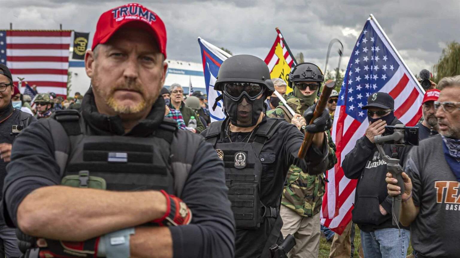 Armed far-right militia members in tactical gear and camouflage at an Oregon protest