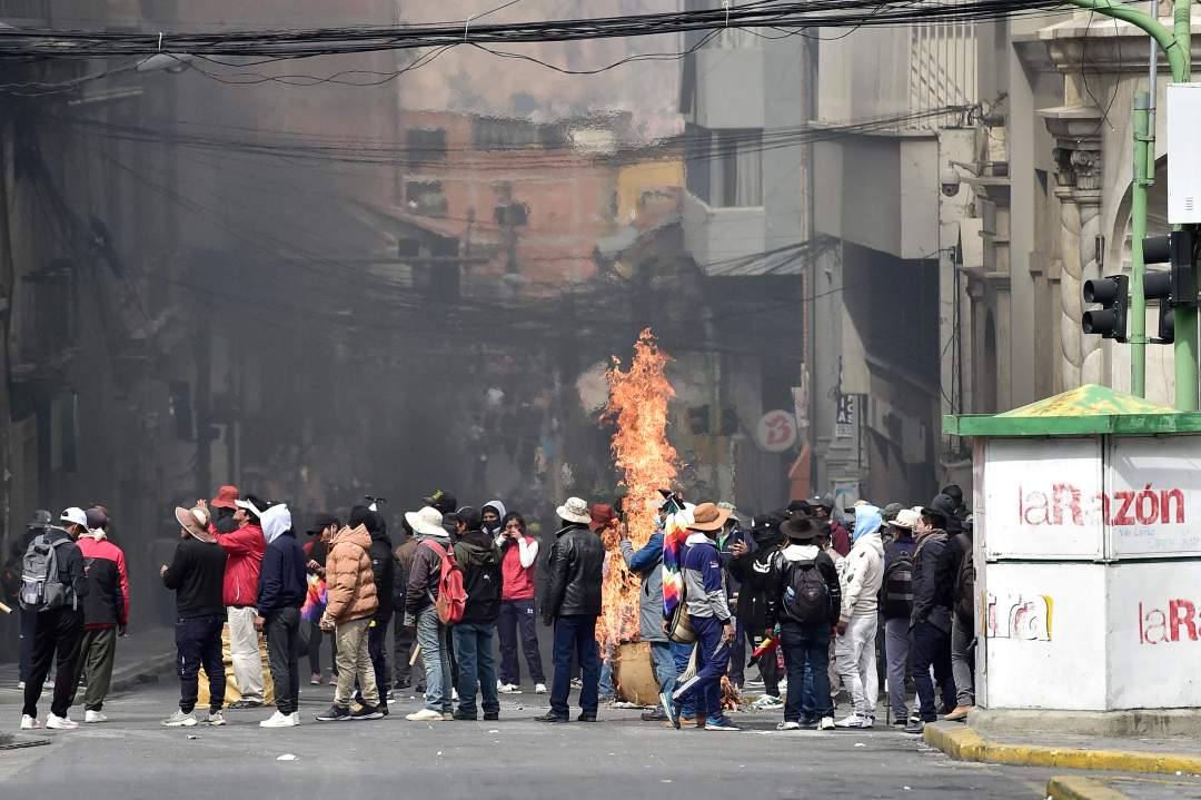 Flames rise from a street barricade during clashes between miners and riot police in La Paz, Bolivia, May 2026