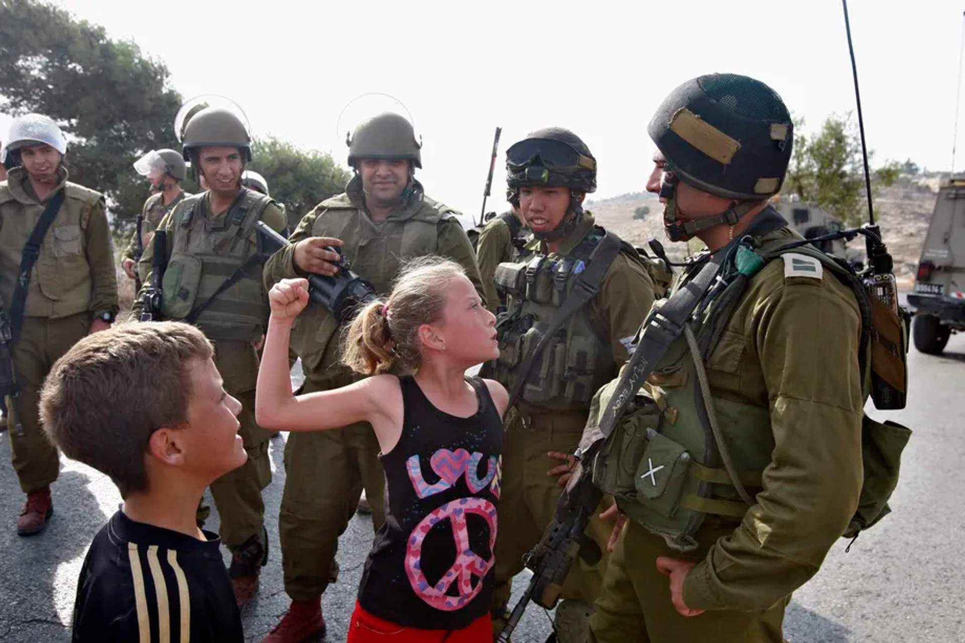 12-year-old Ahed Tamimi tries to punch an Israeli soldier during a protest in Nabi Saleh. November 2, 2012