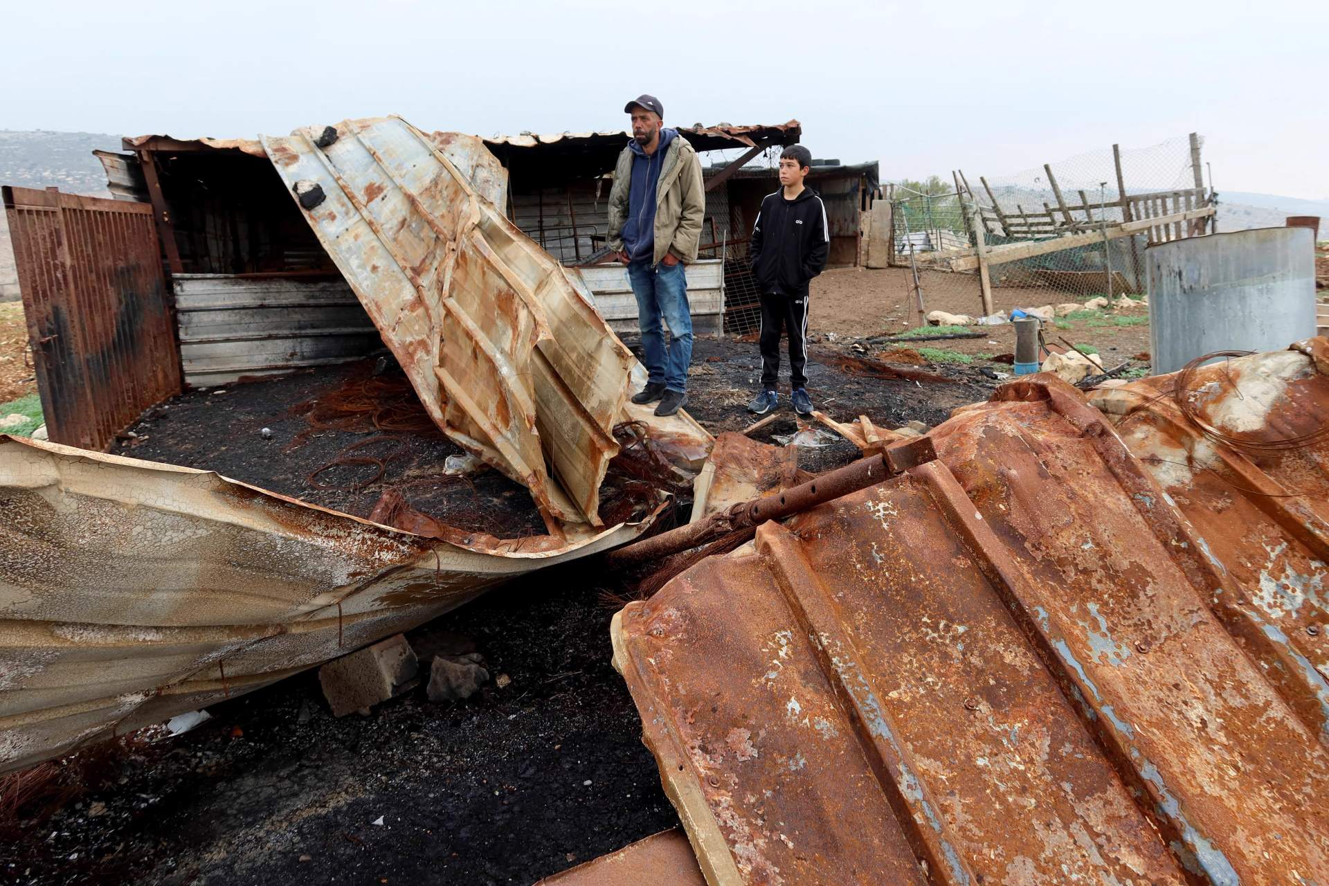 Destroyed Palestinian home with belongings scattered after coordinated settler attack in the occupied West Bank