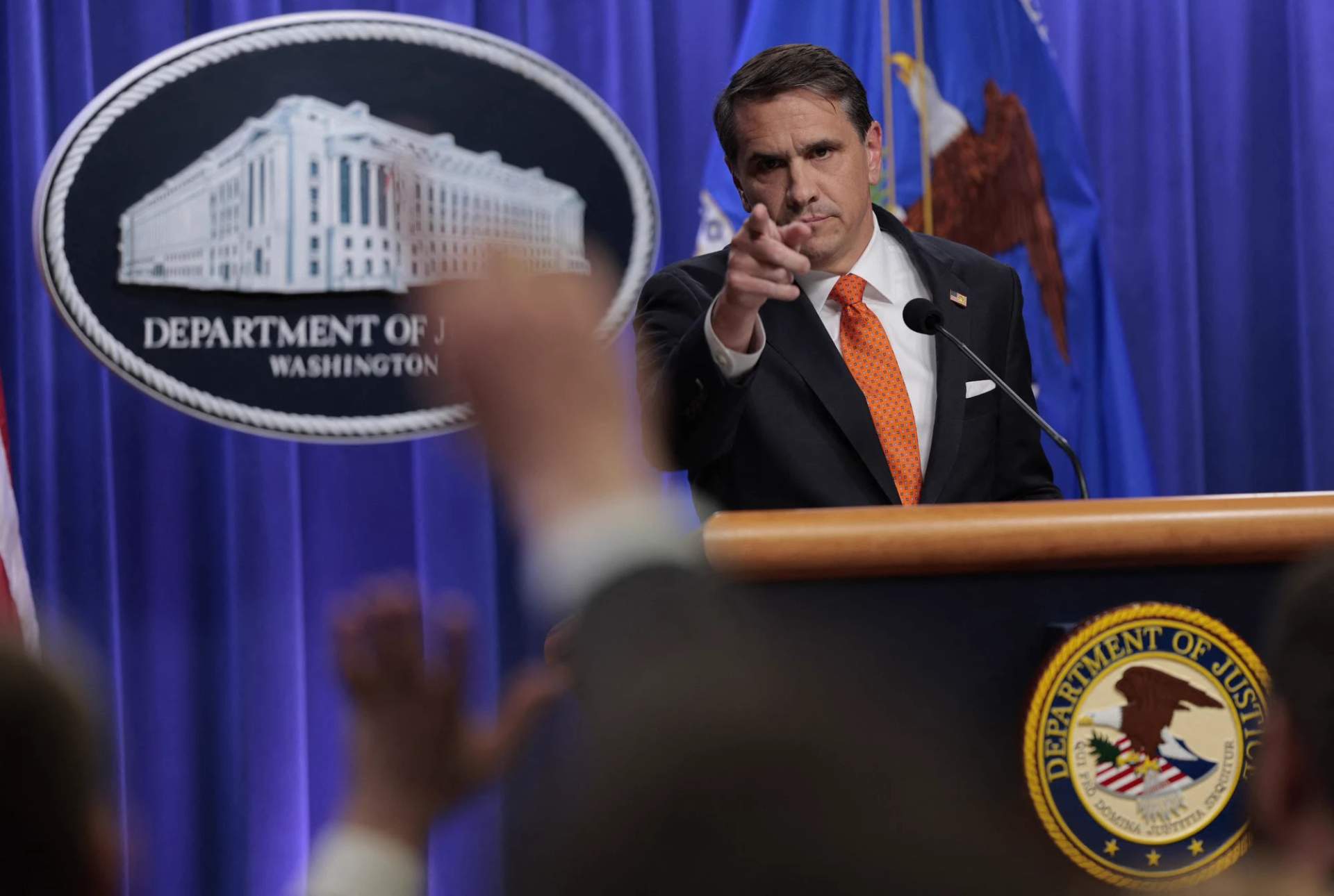 Todd Blanch at DOJ press conference podium, speaking to reporters about the White House Correspondents' Dinner shooting
