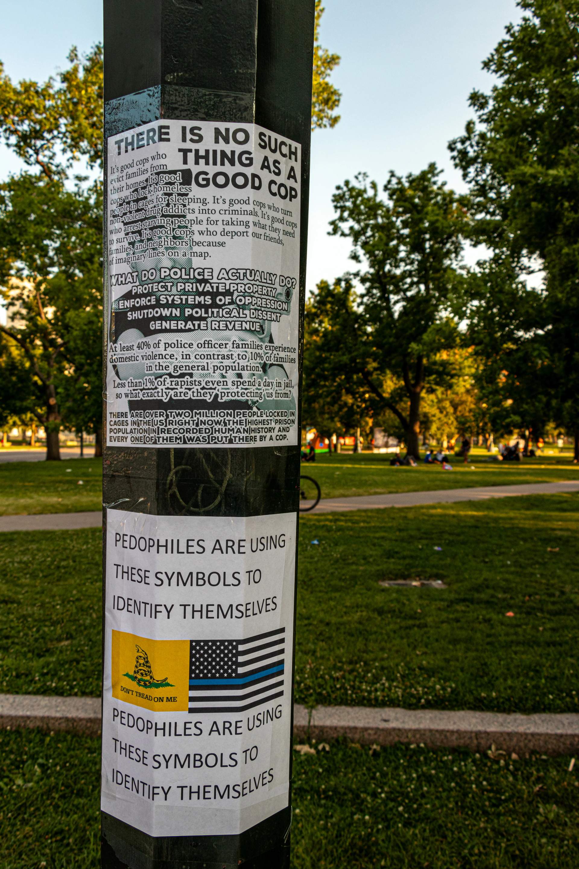 Flyers pasted onto a light pole outside the event.