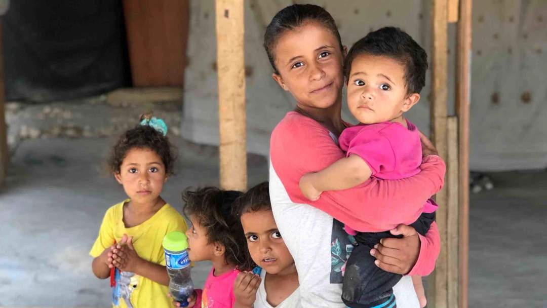 Five Bedouin children outside their home in Khan al-Ahmar village in the occupied West Bank