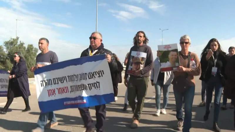 Families of hostages and supporters walking toward the Israel-Egypt border in Kerem Shalom on Thursday. January 25, 2024