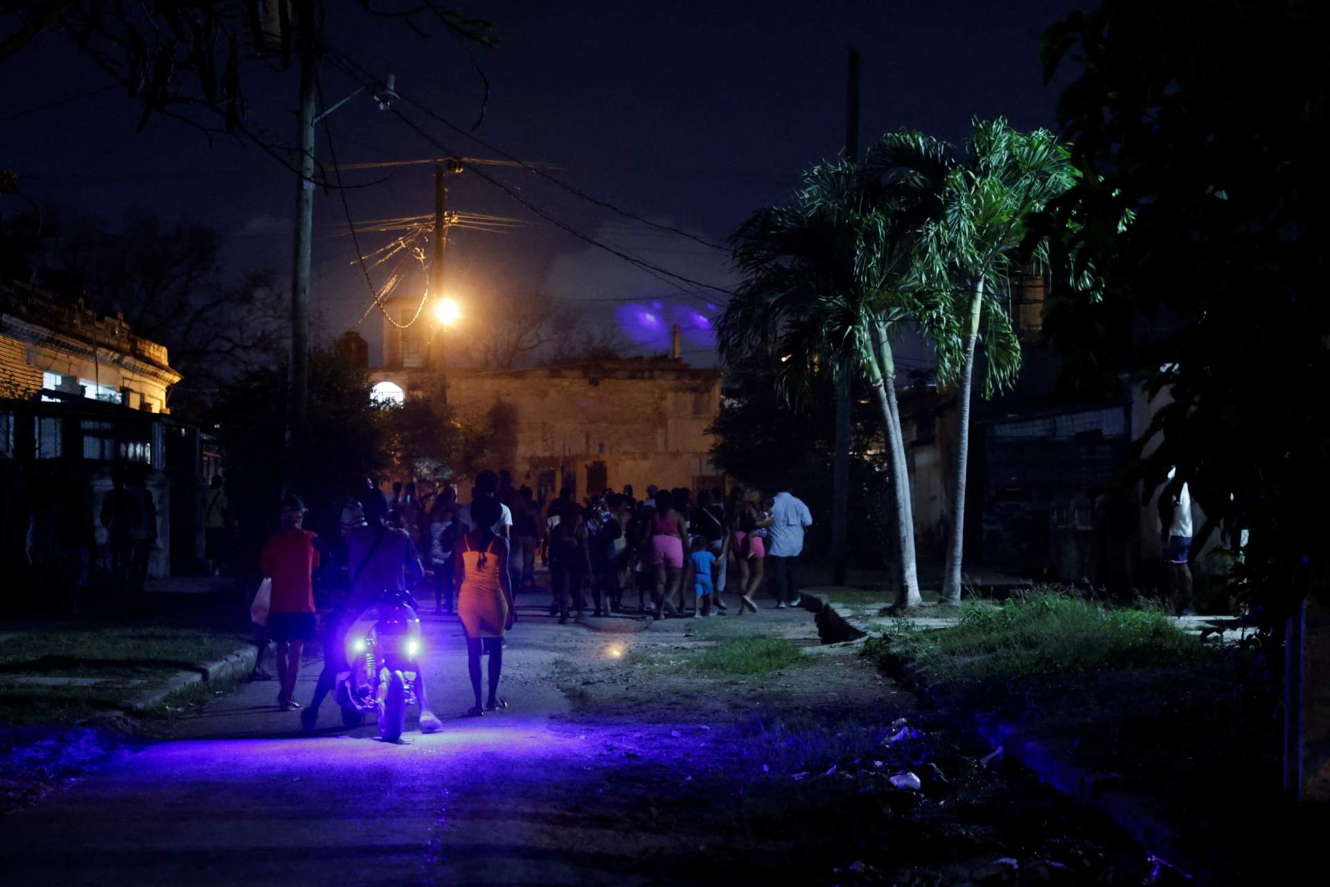 Cubans protest prolonged power outages with a street fire in Havana