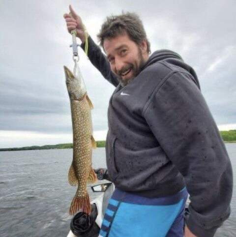 Robert Card Holding a Fish