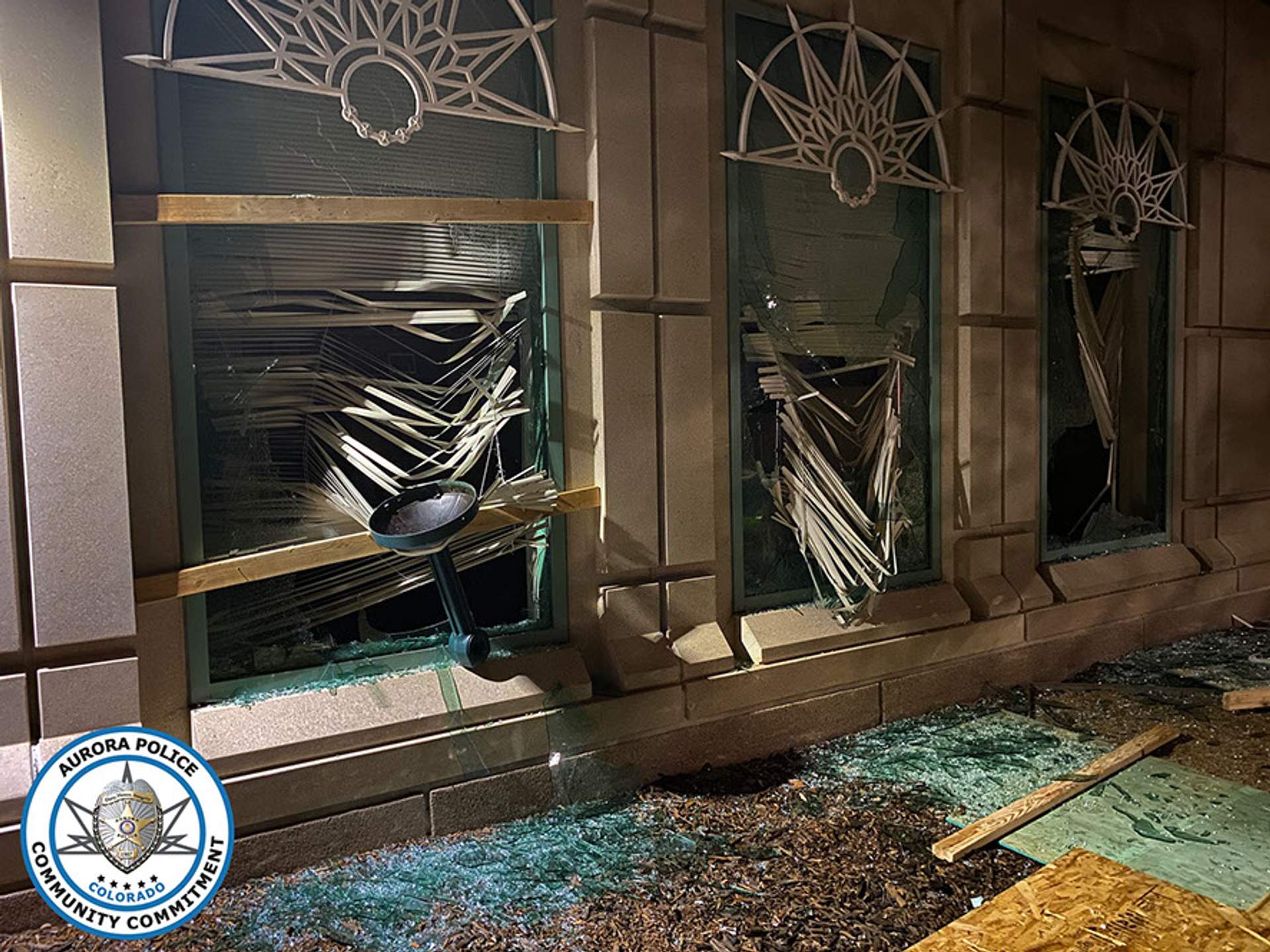 Smashed out windows and broken glass on ground at Aurora Courthouse. [Aurora police file photo]