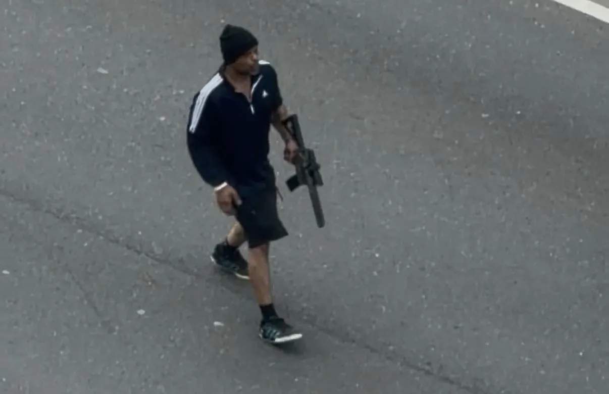 Tyler E. Brown shooting into traffic in Cambridge.