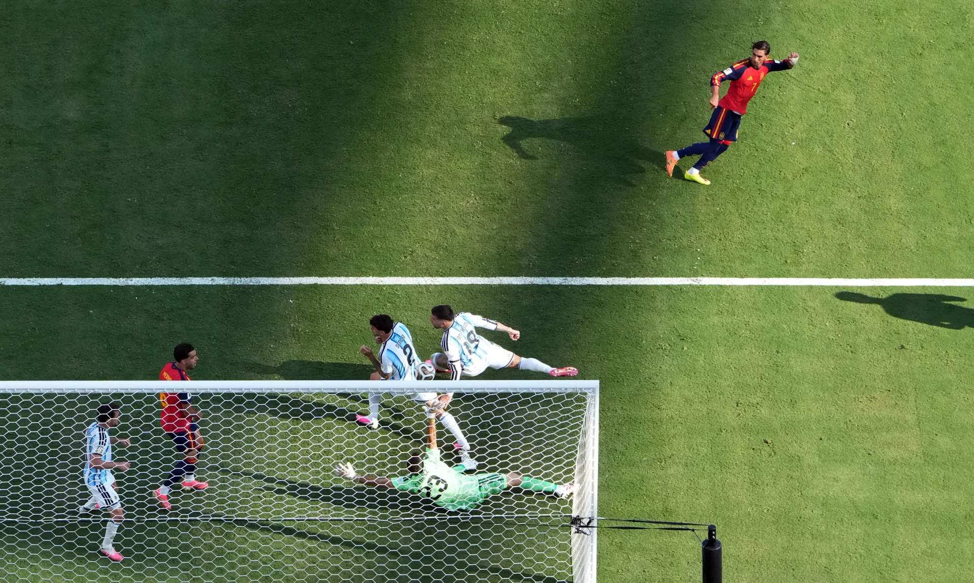 Spain forward Ferran Torres shoots the ball past Argentina goalkeeper Emiliano Martinez to score the winning goal in the 106th minute of extra time during the 2026 FIFA World Cup Final