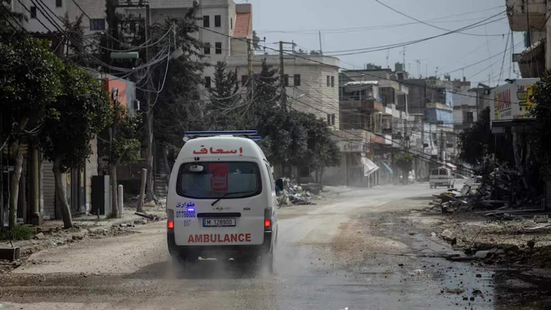 An ambulance crew responds after housing was destroyed by an Israeli air strike in Nabatieh, southern Lebanon.