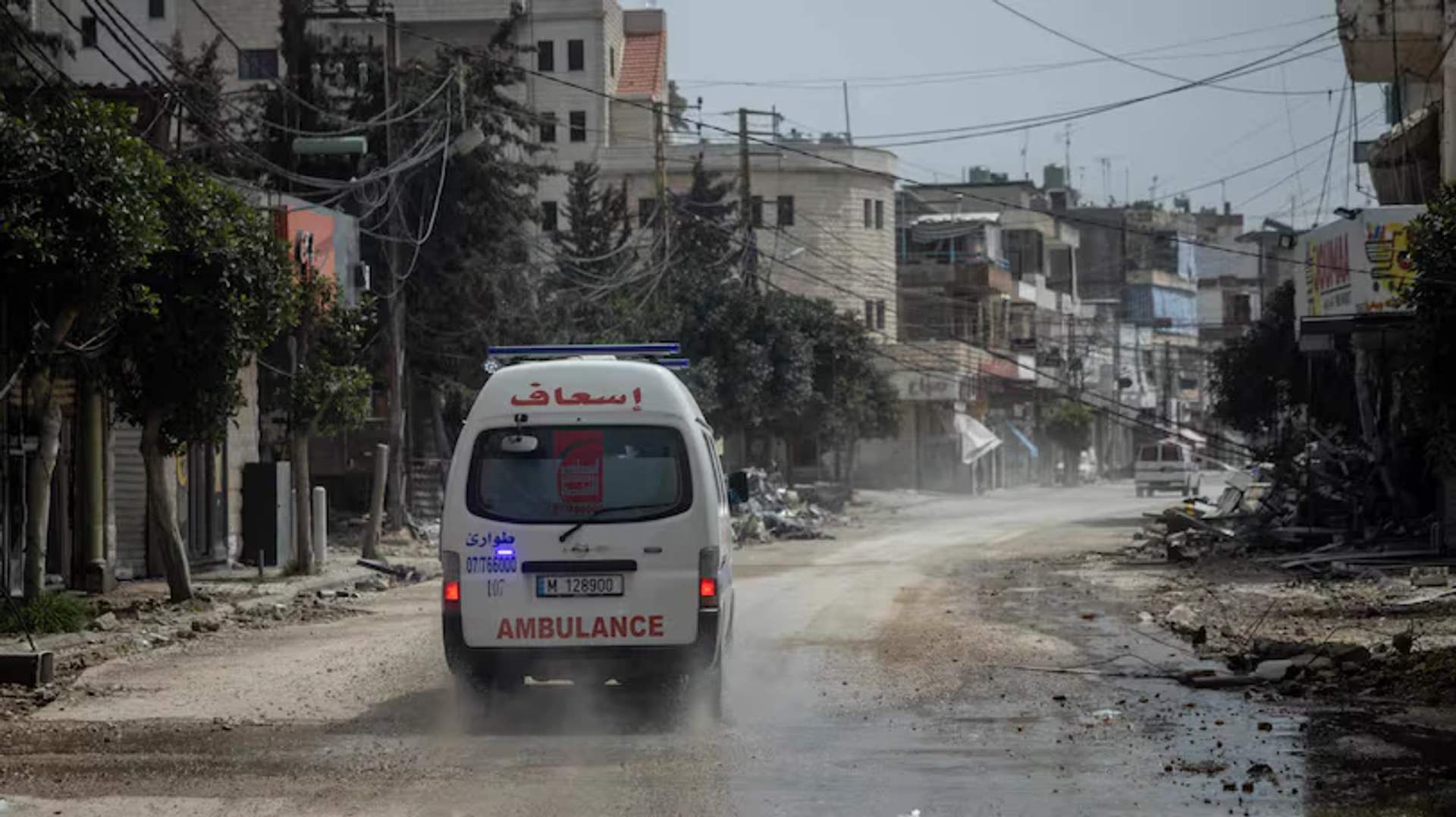 An ambulance crew responds after housing was destroyed by an Israeli air strike in Nabatieh, southern Lebanon.
