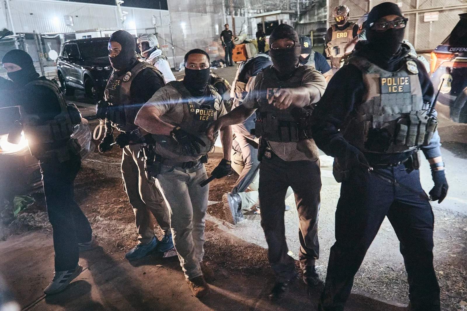 Protesters thrown onto the road by ICE agents during clashes outside Delaney Hall