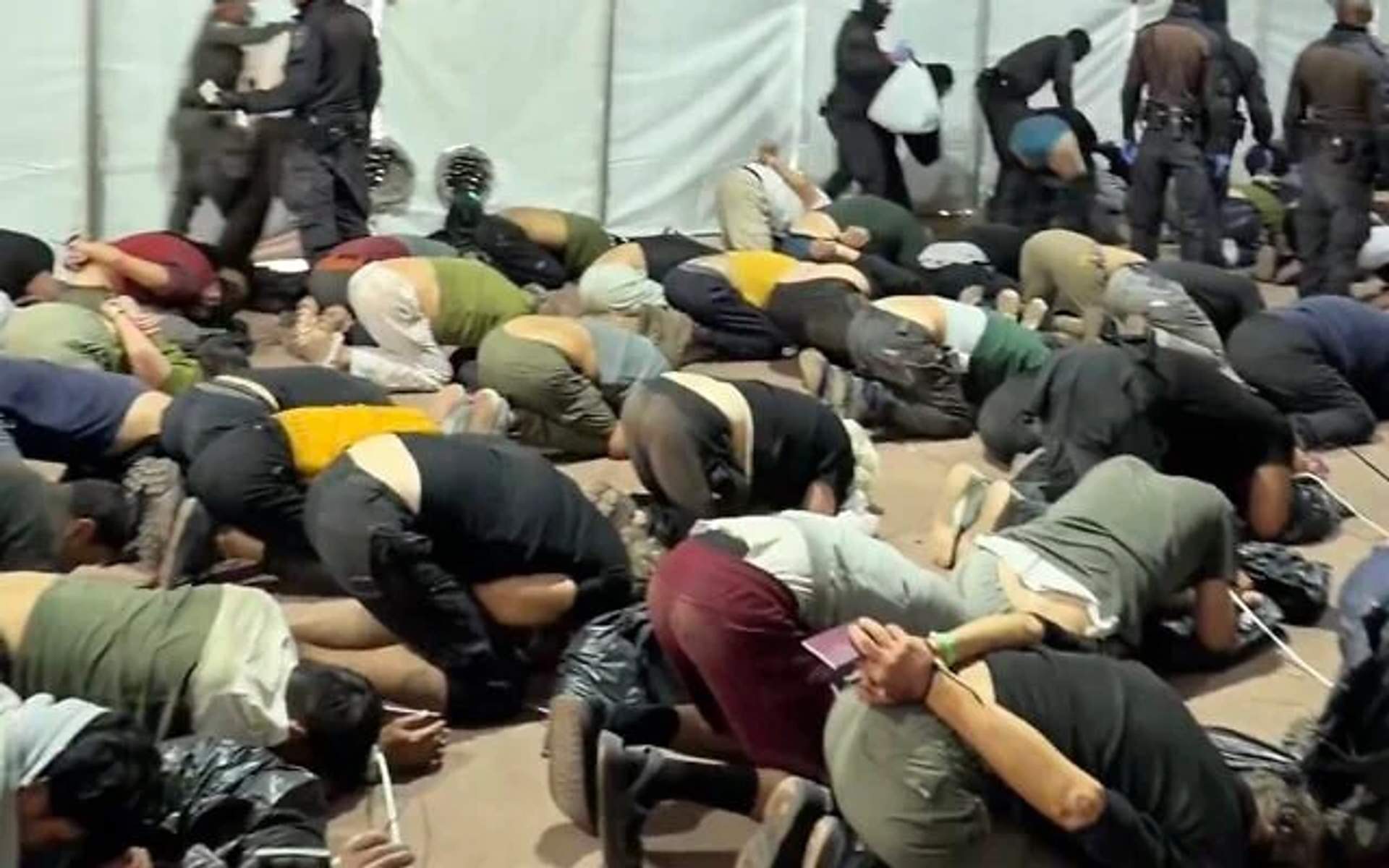 Screenshot from Ben Gvir video showing bound flotilla activists at Ashdod port