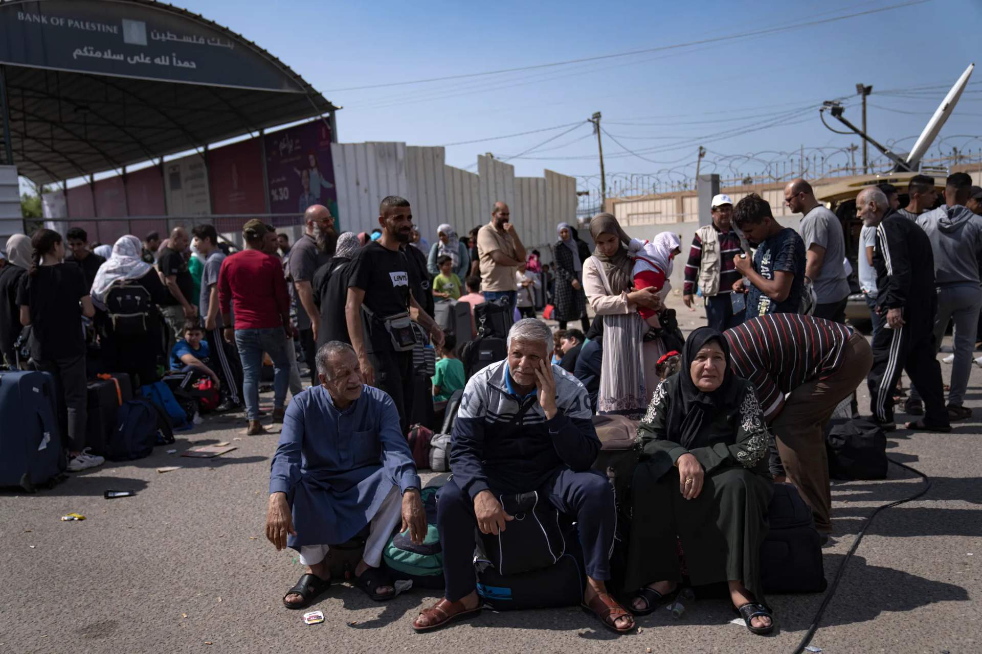 Palestinians wait to cross into Egypt at the Rafah border crossing in the Gaza Strip on Monday, Oct.16, 2023 Fatima Shbair