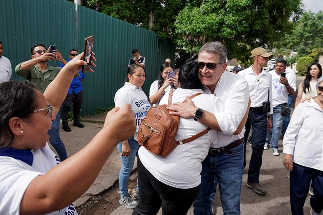 Juan Orlando Hernandez greeted by supporters at airport in Honduras after Trump pardon