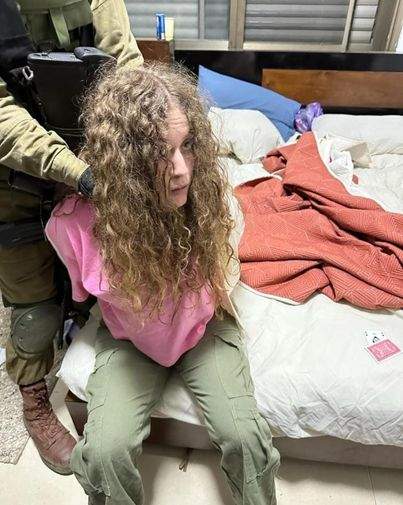 Ahed Tamimi dragged from her bed durring a raid Nov 7th 2023