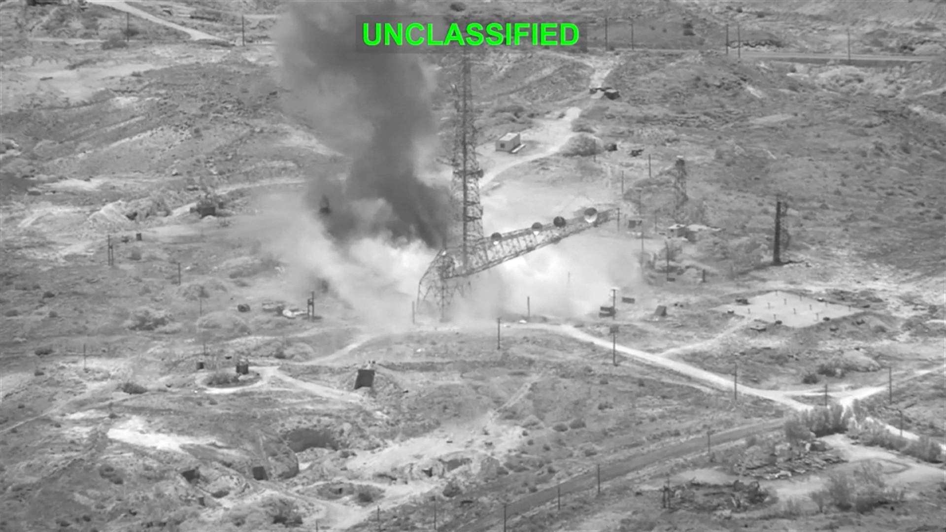 Thick smoke and fire rising from an industrial area after US military airstrikes on Iran on July 16, 2026