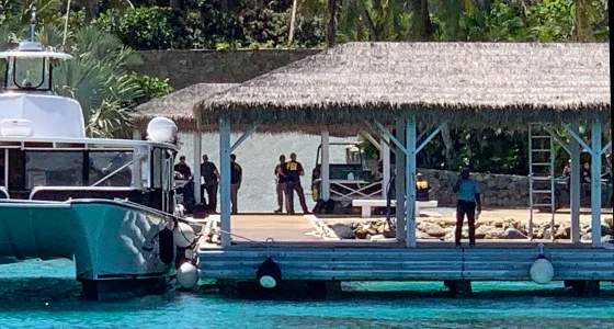 FBI agents on boats approaching Little St. James island during a July 2019 raid