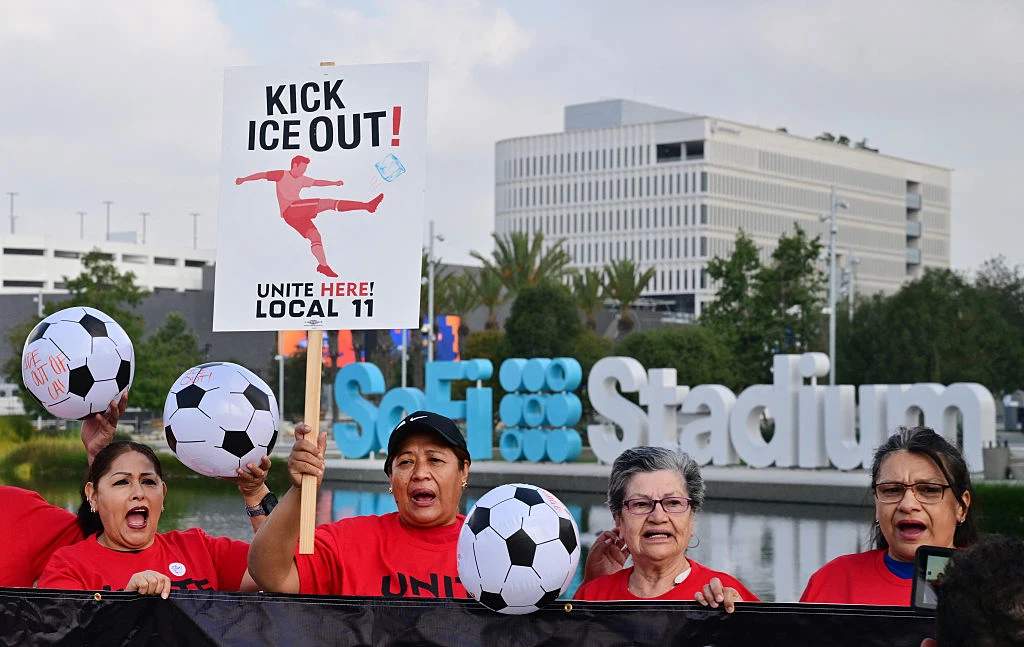 Stadium workers celebrating after authorizing a strike at SoFi Stadium in Los Angeles during World Cup preparations