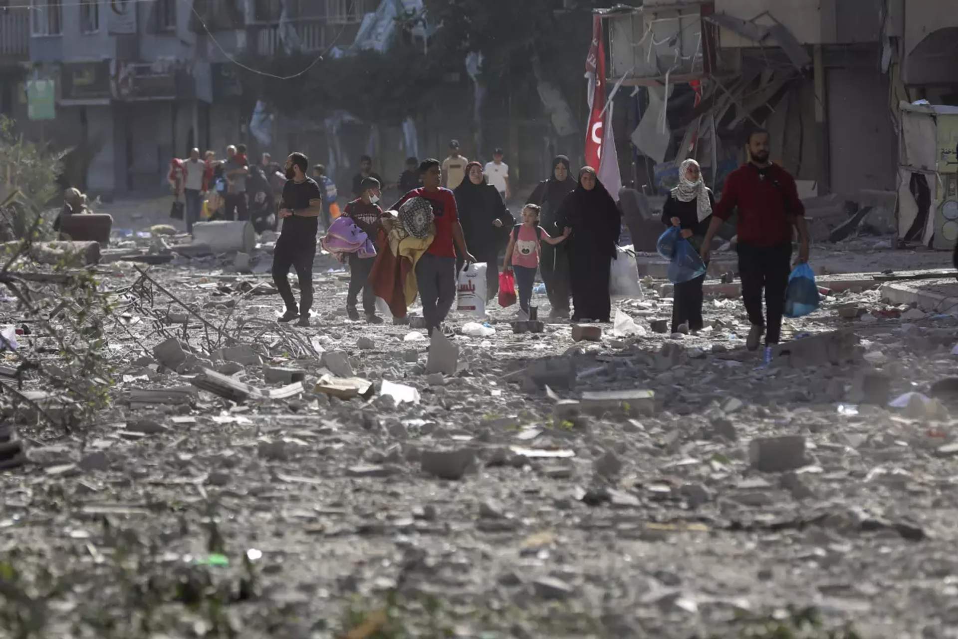 Palestinians leave their homes following Israeli bombardment on Gaza City, Monday, Oct. 30, 2023. AP Photo Abed Khaled