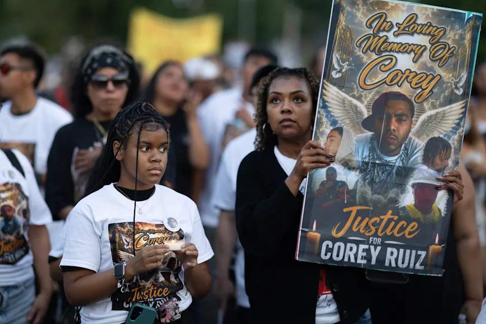 Family members of Corey Ruiz marching in protest with a crowd of demonstrators