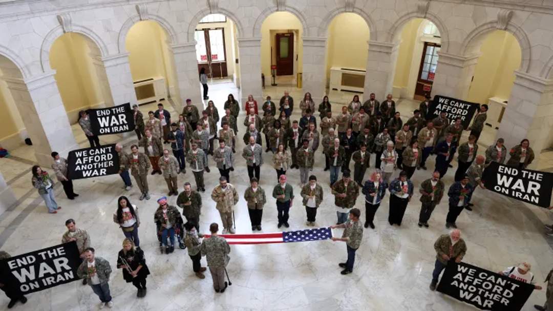 Dozens of US veterans and family members of military personnel gather to protest the Iran war at the US Capitol.