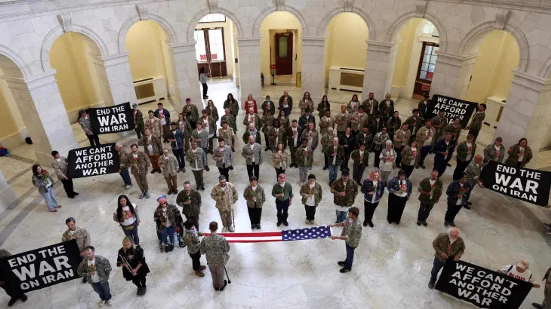 Dozens of US veterans and family members of military personnel gather to protest the Iran war at the US Capitol.