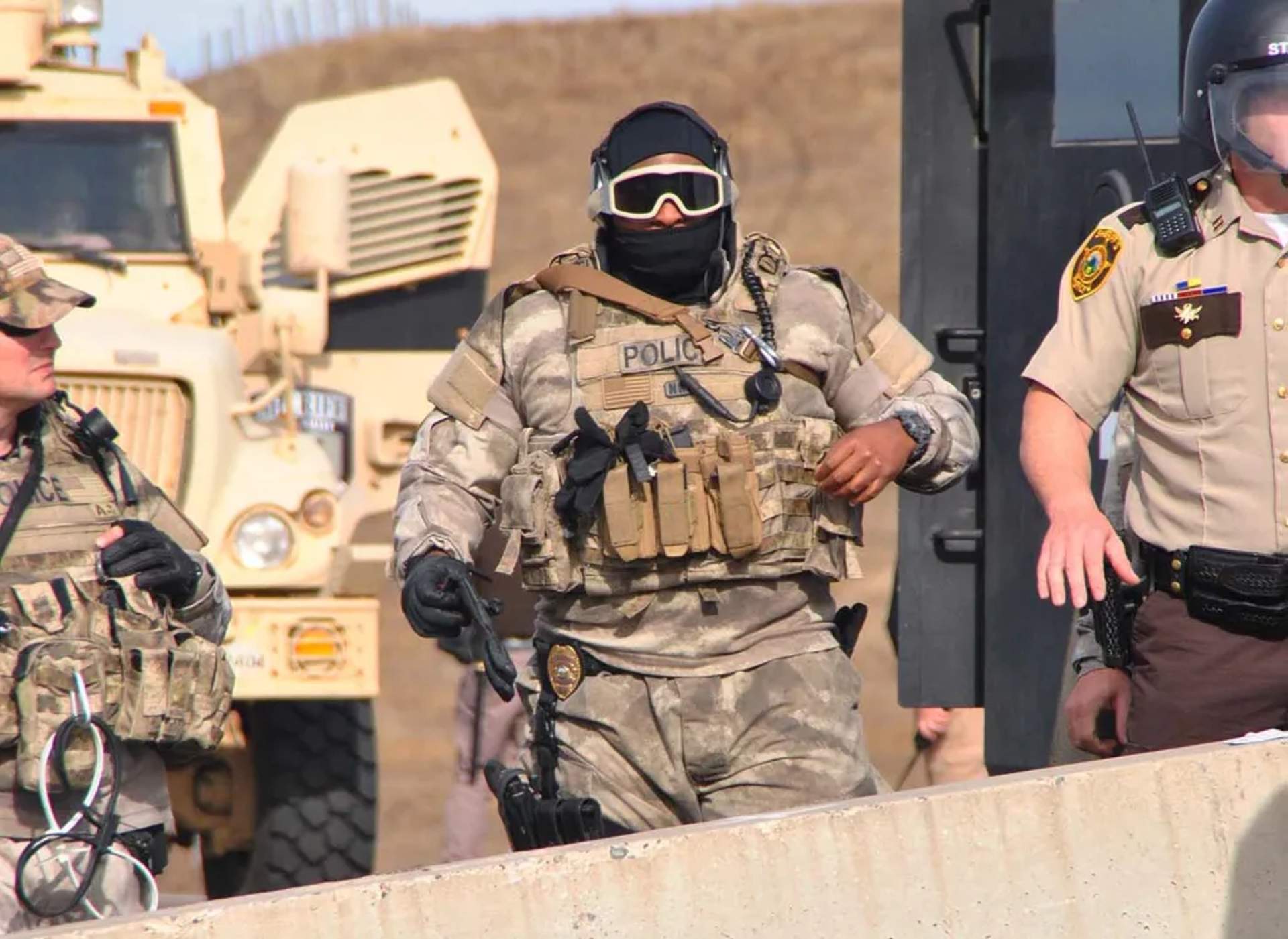 Law Enforcement Sets Up Barricade at Backwater Bridge - [Photograph by C.S. Hagen]