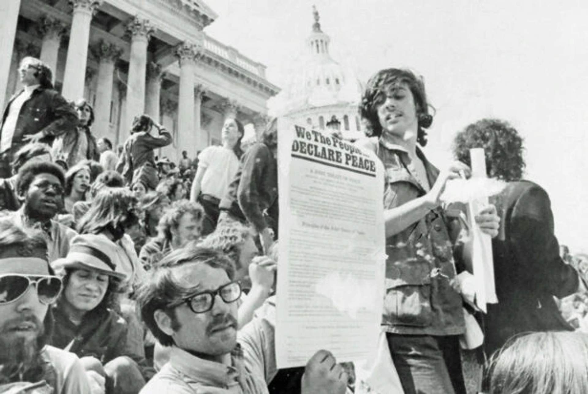 A demonstrator holds a copy of the People’s Peace Treaty on the steps of the U.S. Capitol during Mayday protests May 5, 1971. (Flickr/Washington Area Spark)
