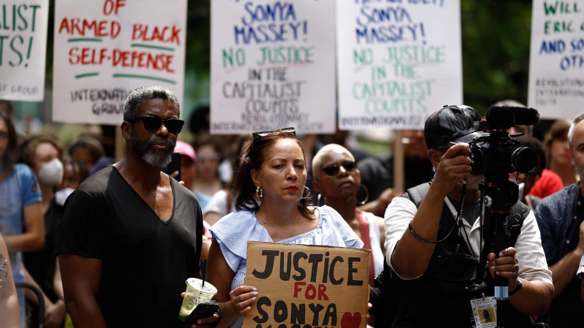Crowd of protesters holding signs demanding justice for Sonya Massey at a National Day of Mourning demonstration in Chicago