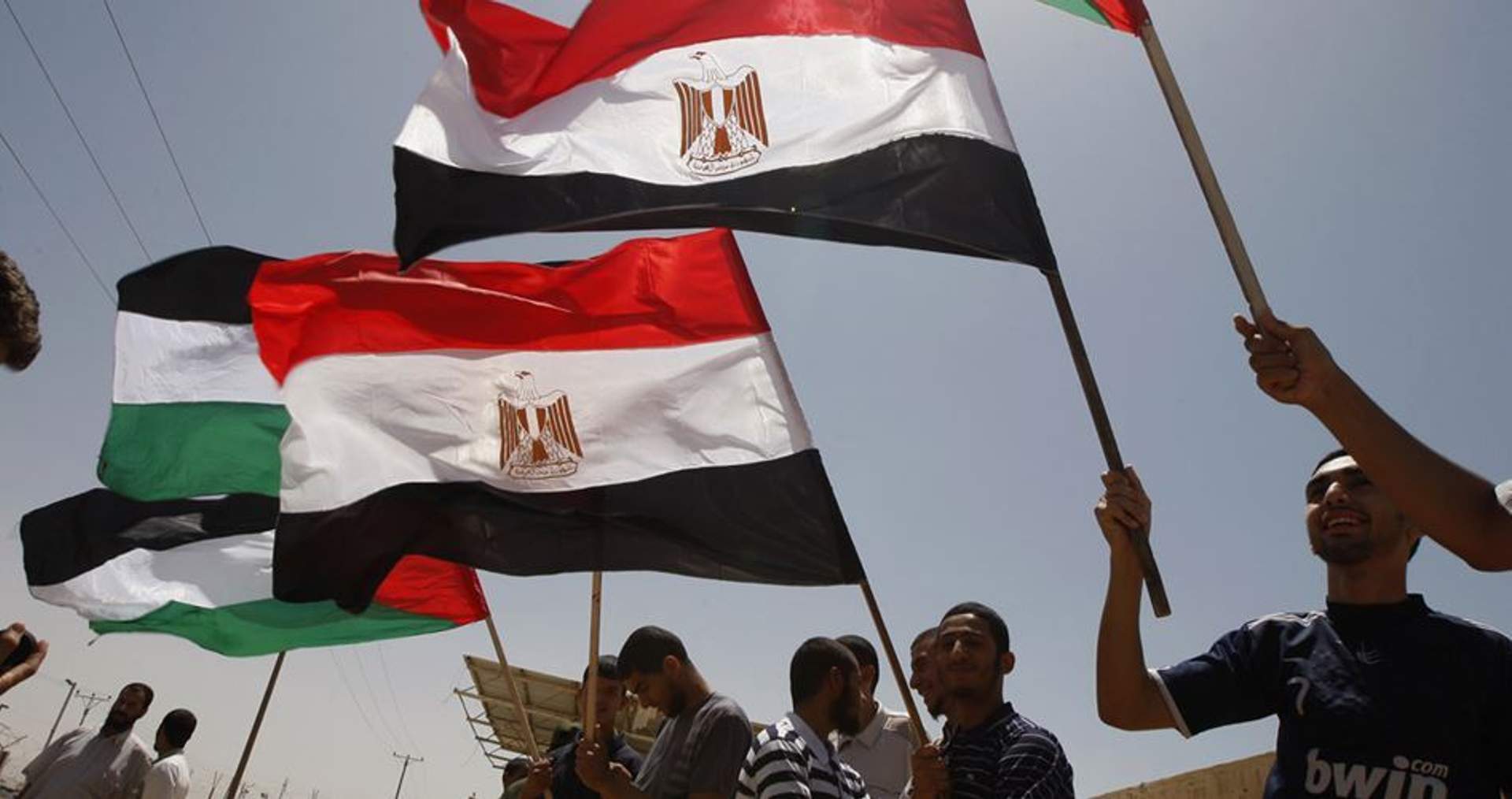 Palestinians waving Egyptian flags in Rafah, July 1, 2017