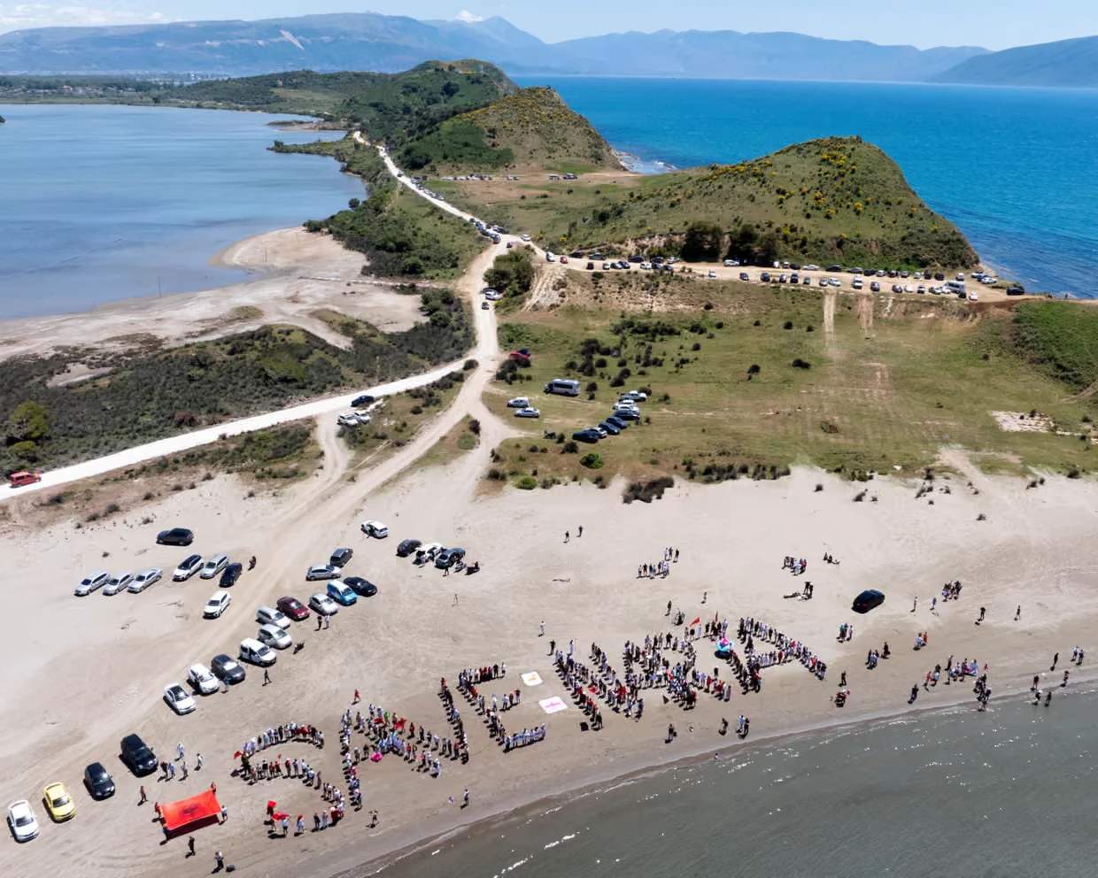 Protesters spell out SAVE NARTA on the beaches of Narta Lagoon