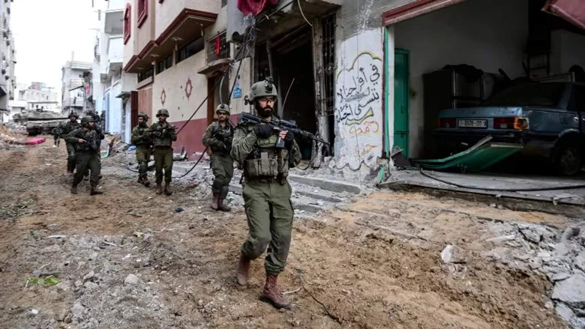 Israeli soldiers are seen in the Shejaia district of Gaza city - Dec 8th, 2023 [Yossi Zeliger Reuters]