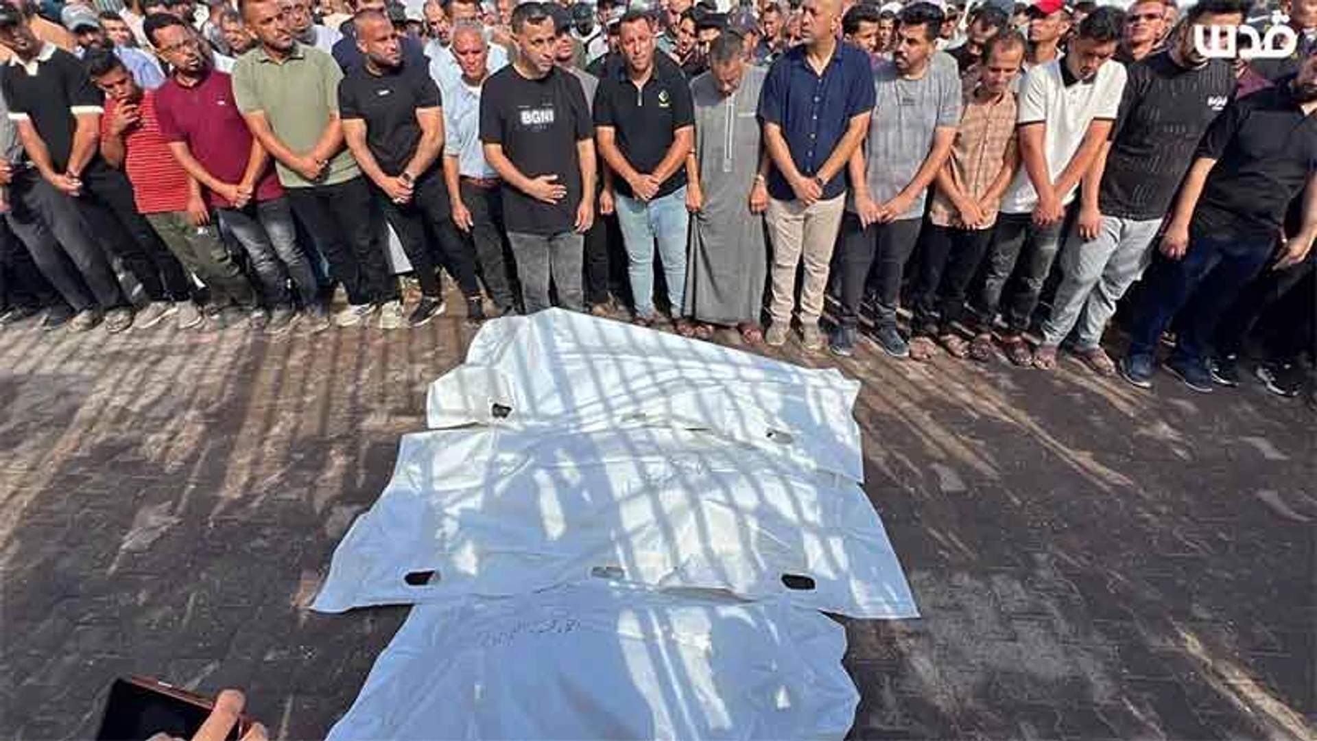 Mourners carry the body of a Palestinian killed in an Israeli airstrike in Gaza, August 2026