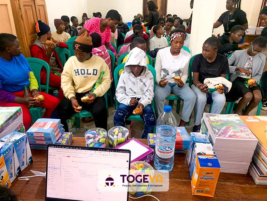 Students at Togeva Orientation Season 2 with their new school supplies