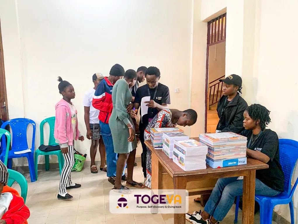 Students collecting supplies at the distribution table
