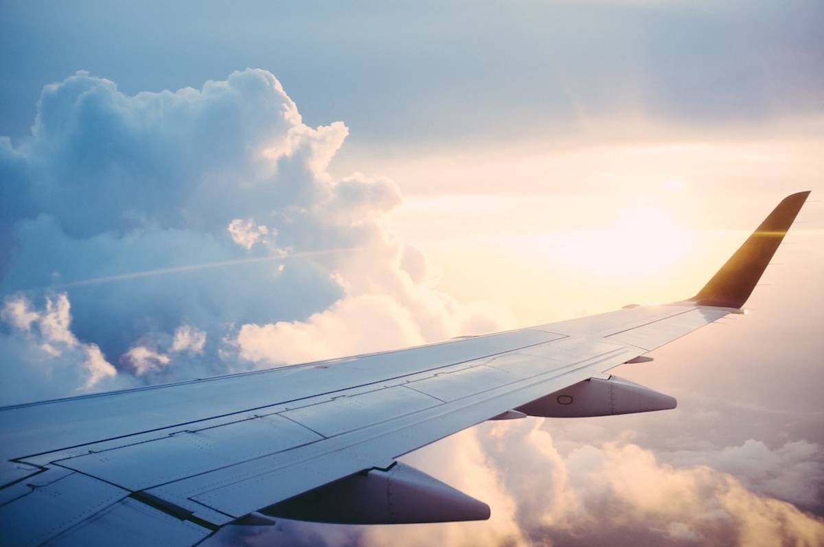 Airplane wing at sunset
