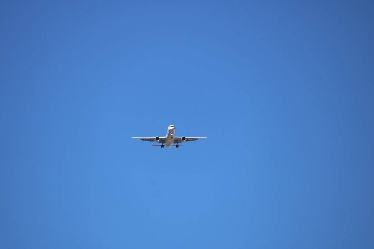 Plane flying over San Jose airport