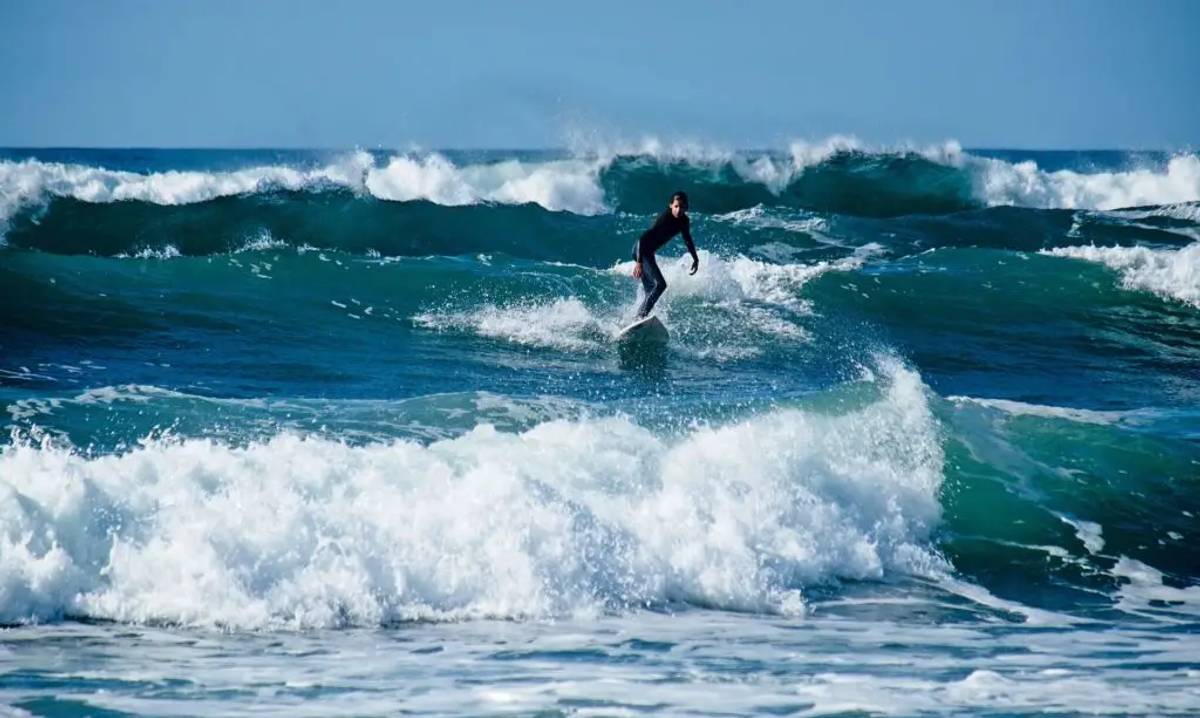 Offshore waves and a surfer riding them
